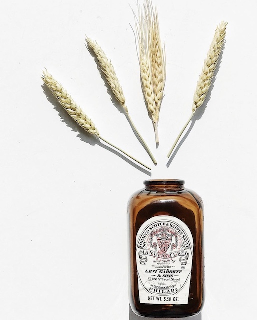 An old snuff bottle with wheat coming out,