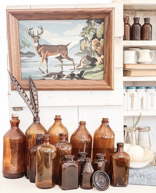 Amber bottle grouping staged as decor