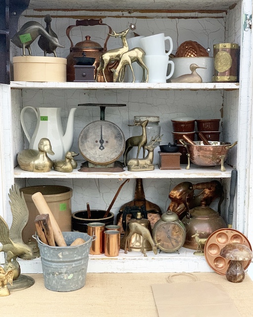 a staged out shelves at a vintage market