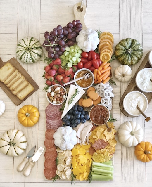 A heap of snacks on a cutting board.