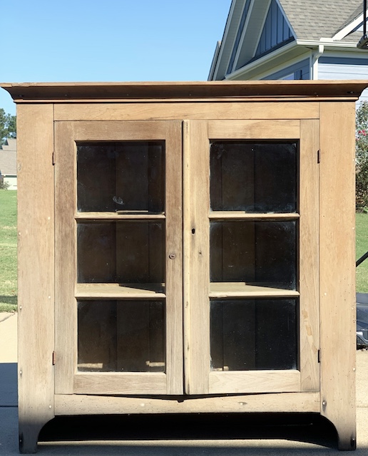 old cabinet getting cleaned by the sun and wind outside