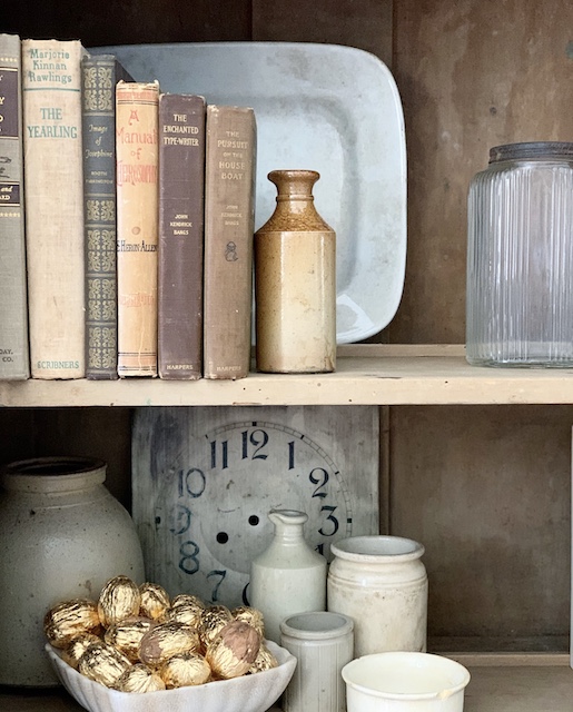 shelves styled with vintage decor