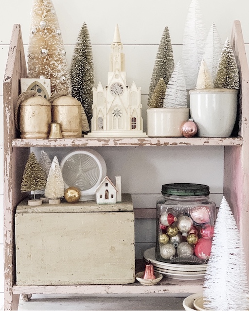 pink shelf with white and and pink ornaments