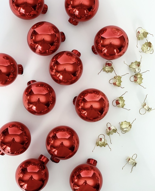 red ornaments with their tops off