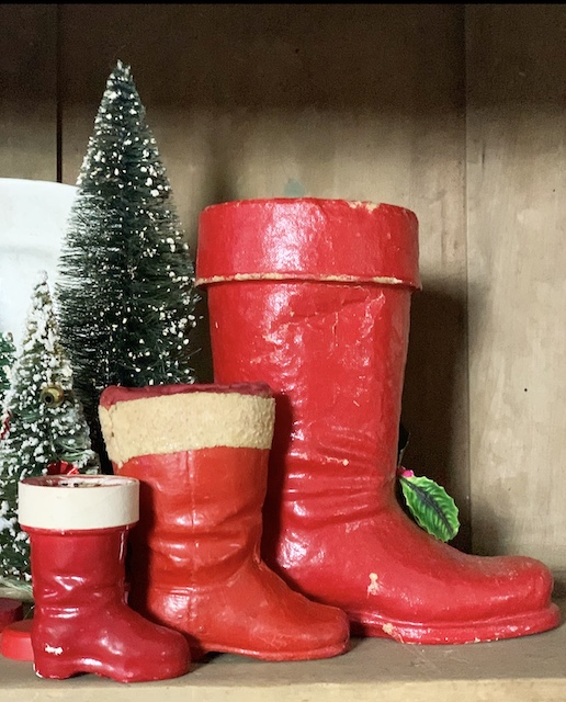 three paper mache santa boots