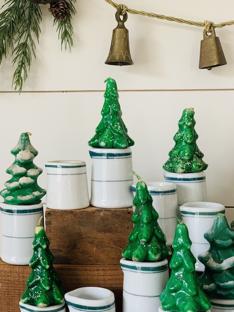 vintage christmas candle display idea using trees and creamers up close shot