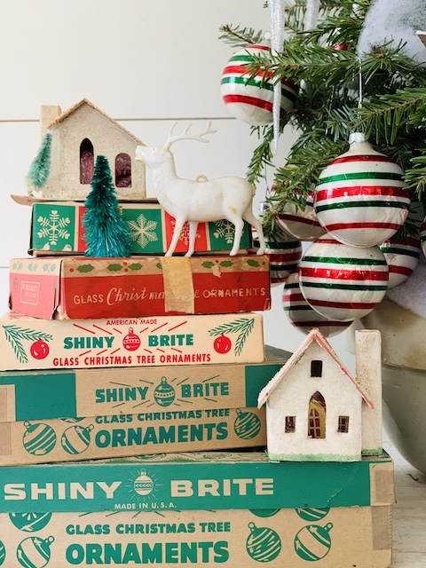 puts houses on boxes of old ornaments