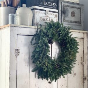 big wreath on a cabinet