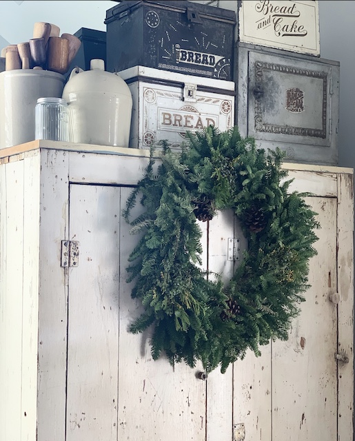 big wreath on a cabinet