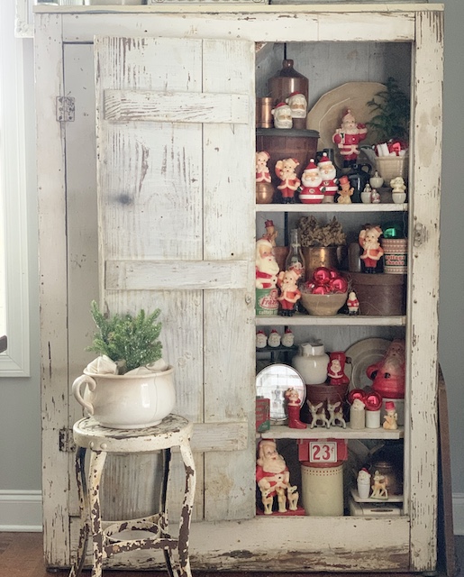 santas stuffed into. a cabinet