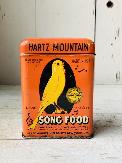 vintage spice tin with bird graphic