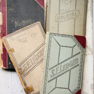 a stack of old ledgers