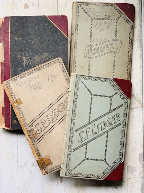 a stack of old ledgers