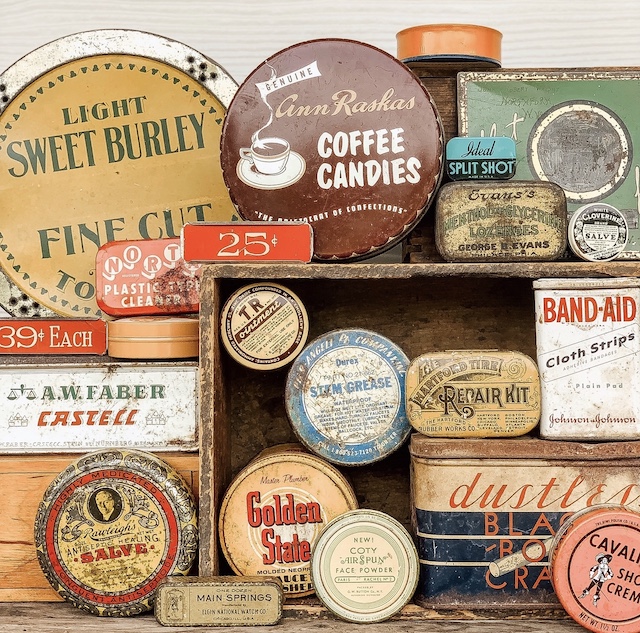 a display packed with old tins