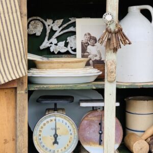 A cupboard packed with a wide variety of vintage items