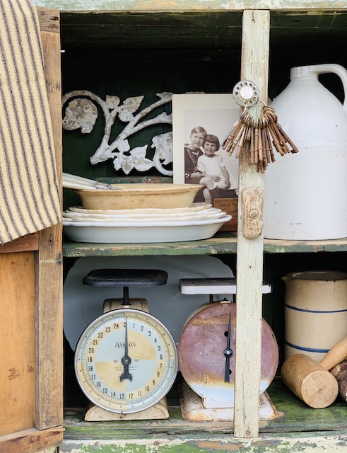 A cupboard packed with a wide variety of vintage items