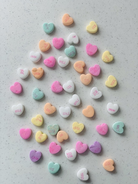 conversation hearts all on a table
