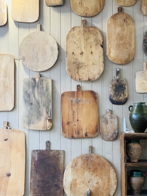 a wall full of old bread boards