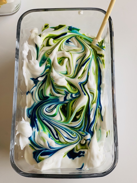 the food coloring all mixed together in the shaving cream