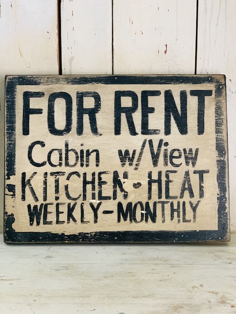 front view of a cabin sign