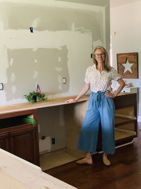 a picture of me standing in the middle of our kitchen remodel