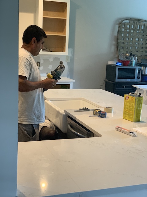 drilling the hole for the sink in the counters