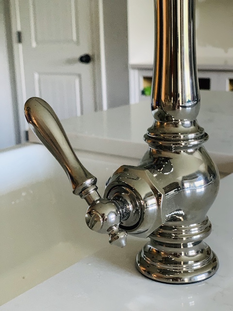 a close up of the handle of our new faucet