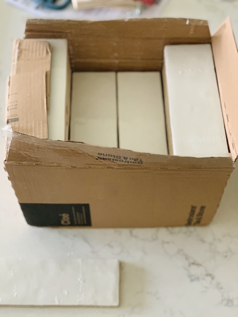 a box of the new kitchen tile
