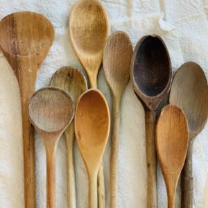 a whole mess of old vintage wooden spoons