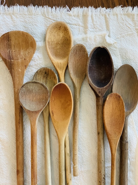a whole mess of old vintage wooden spoons