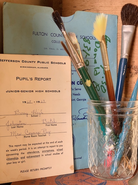 report cards and paint brushes