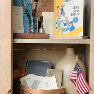 Here is a grouping of vintage back to school things in a cupboard