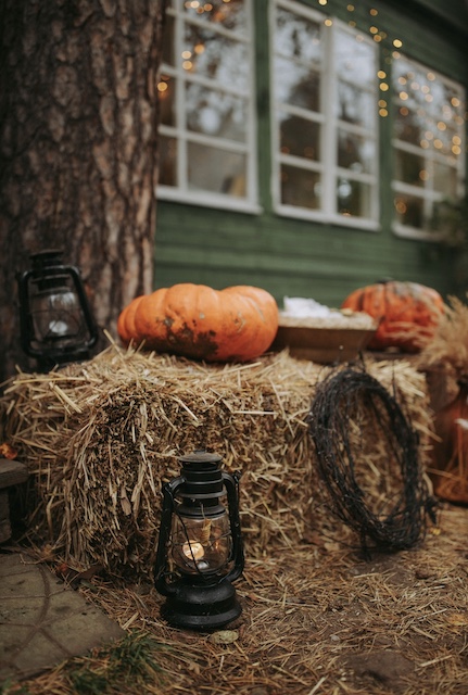 a bale of har and a few lanterns for fall