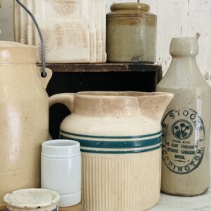 a grouping of some stoneware pieces on the table