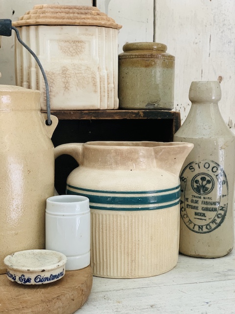 a grouping of some stoneware pieces on the table