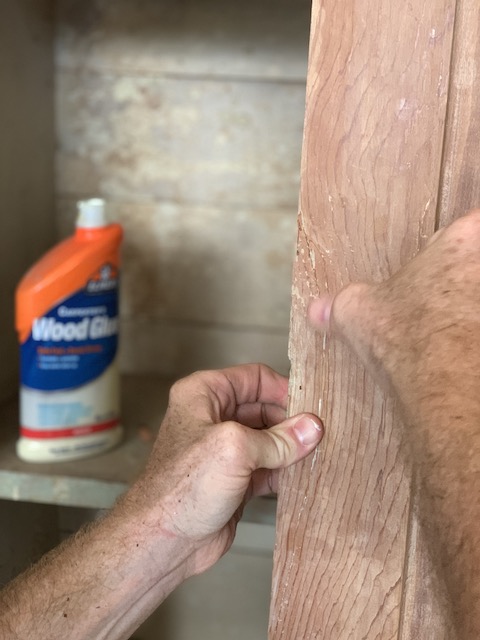 holding the glued piece down