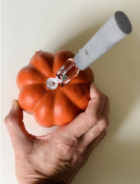 putting the peeler inside the foam pumpkin