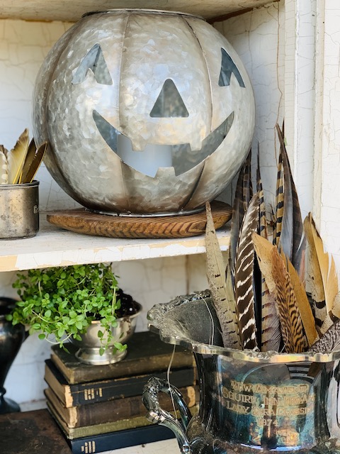 metal pumpkin on shelf