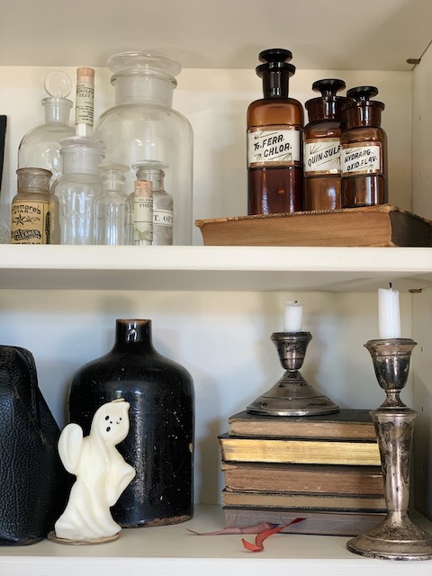 bottles up close with a ghost
