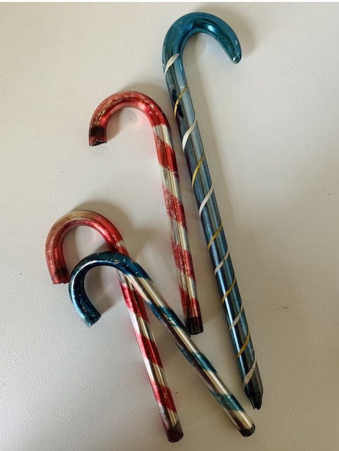 a set of four mercury glass candy canes