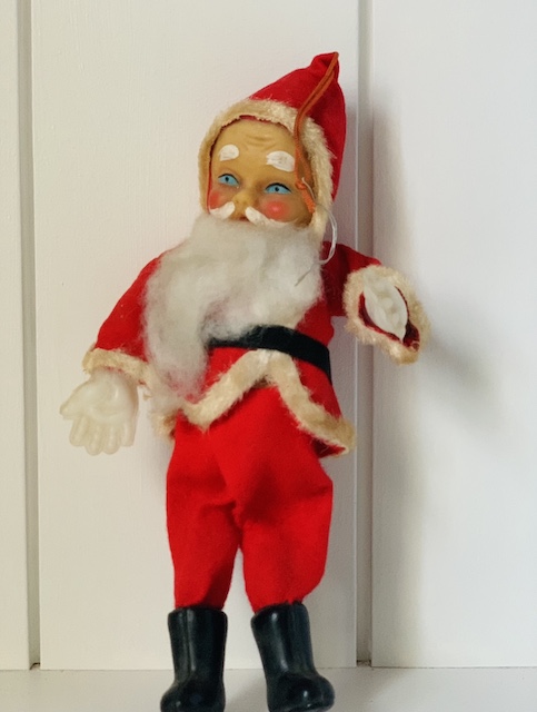 an old santa with bright blue eyes