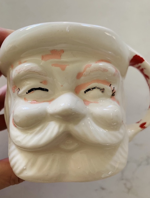 santa mug with a lot of chippy paint