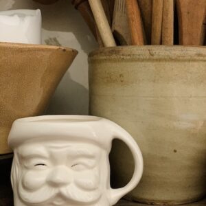 white santa mug sitting on a shelf