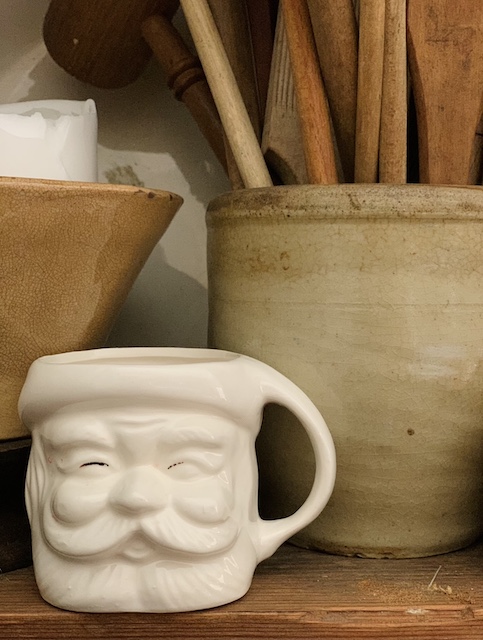white santa mug sitting on a shelf