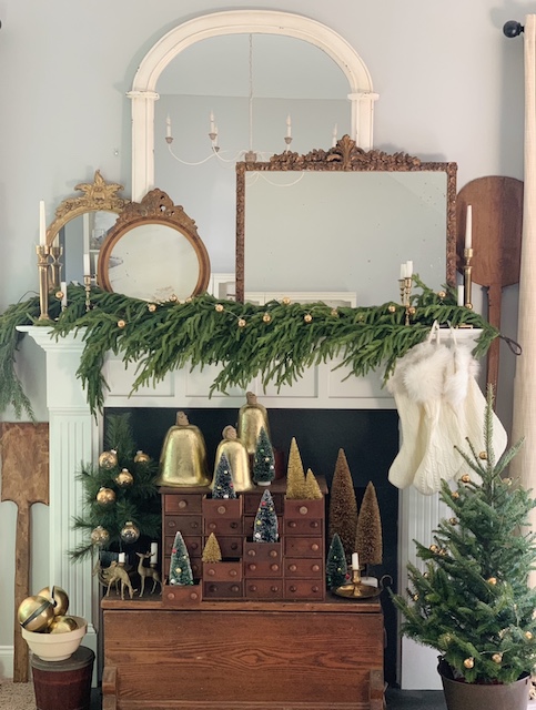 a view of the entire simple Christmas mantel