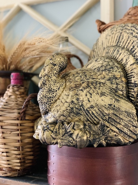 a large golden turkey all styled on the shelf
