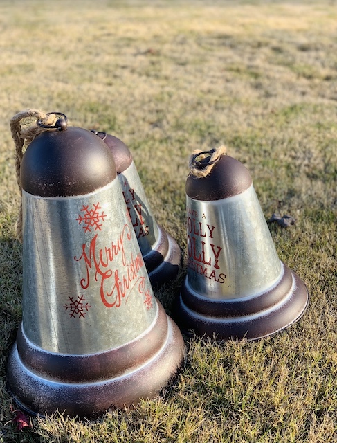 unpainted bells that were silver sitting on the grass