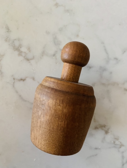 an old butter mold on the counter