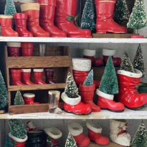 all of the vintage Santa boots inside a cabinet