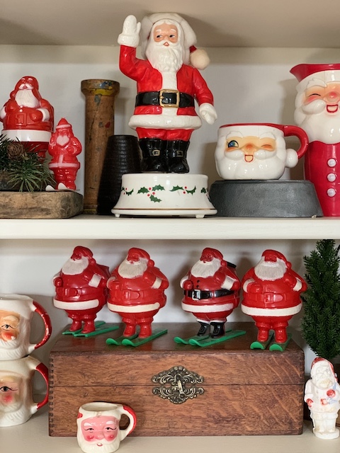 a close up of the vintage santa candy containers